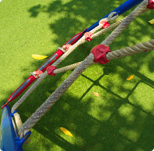 a top down of a playset with synthetic turf on the ground