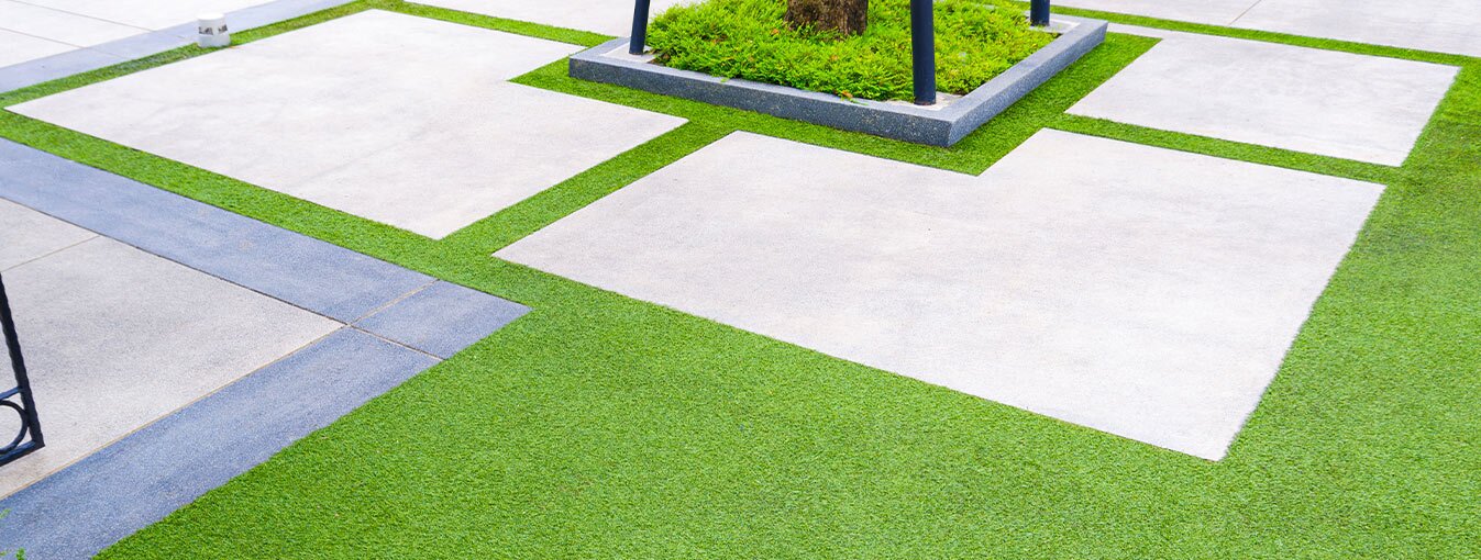 concrete pavers next to grass