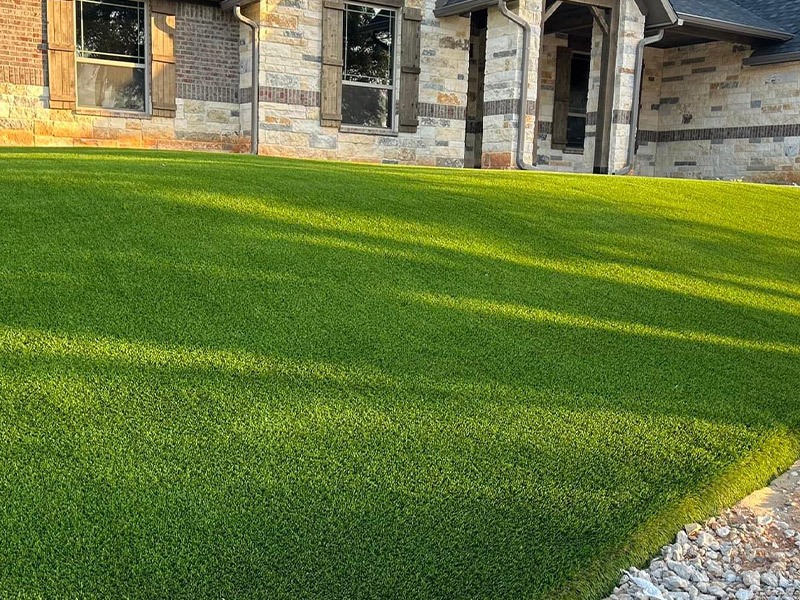 bright green turf recently installed in front yard of someones home